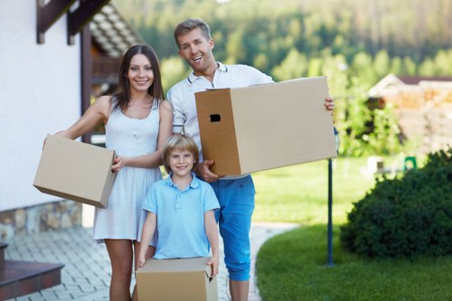 Professional movers organising boxes and fragile items