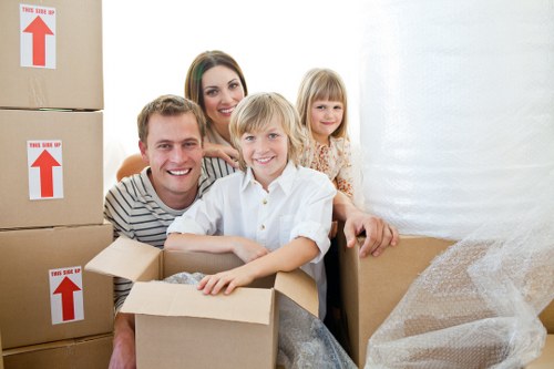 Professional movers handling boxes and furniture in Cambridgeheath