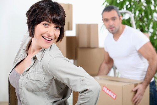 Packed moving boxes and furniture ready for transport