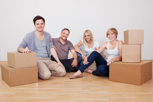Loading household items into a removals van for a local move