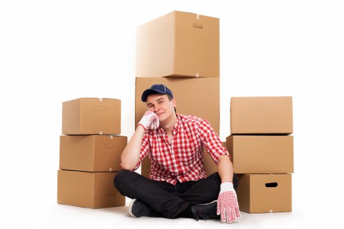 Local removal team handling boxes and household items for transport